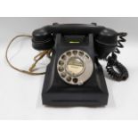 A vintage bakelite telephone GPO no.332L