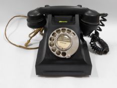 A vintage bakelite telephone GPO no.332L