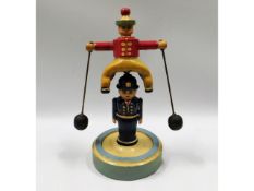 An early 20thC. wood & metal folk art balance toy