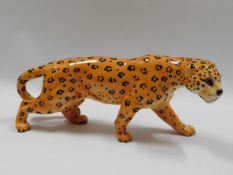 A vintage Beswick pottery leopard, 11.5in long x 4