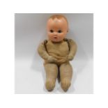 An Plastex straw filled doll, 15in tall