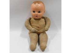 An Plastex straw filled doll, 15in tall