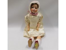 A Schoenau Hoffmeister porcelain headed doll, 24in