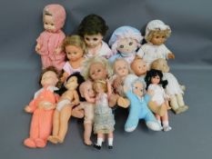 A quantity of 15 mixed dolls including Fisher Pric