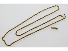 A yellow metal rope chain, tests electronically as