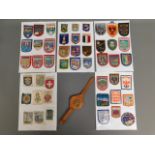 A quantity of cloth badges & one leather wrist bad