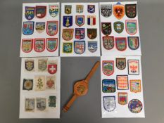A quantity of cloth badges & one leather wrist bad