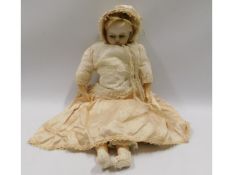 An antique wax head doll, 18in tall