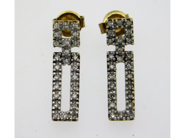 A pair of 9ct gold earrings set with diamonds, 20m