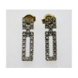 A pair of 9ct gold earrings set with diamonds, 20m