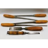 Two wooden handled chisels twinned with four wooden handled draw pins