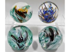 Four Liskeard glass paperweights, two 1976 & 1977