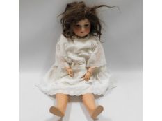 An Armand Marseille porcelain headed doll, 24in ta