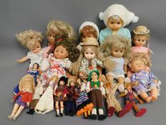 A quantity of 18 mixed dolls including Folkart & P