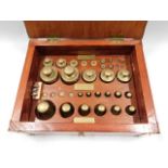 A cased set of weights with plaque to box "W & T A