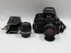 A Nikon FE 35mm film camera with a 28mm & 50mm len
