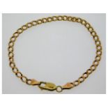A 9ct gold curb chain bracelet with 14ct gold clas