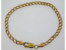 A 9ct gold curb chain bracelet with 14ct gold clas