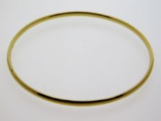 A 9ct gold bangle, internal diameter 56mm, 11.6g