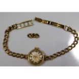 A ladies 9ct gold Tudor wrist watch with spare lin