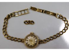 A ladies 9ct gold Tudor wrist watch with spare lin