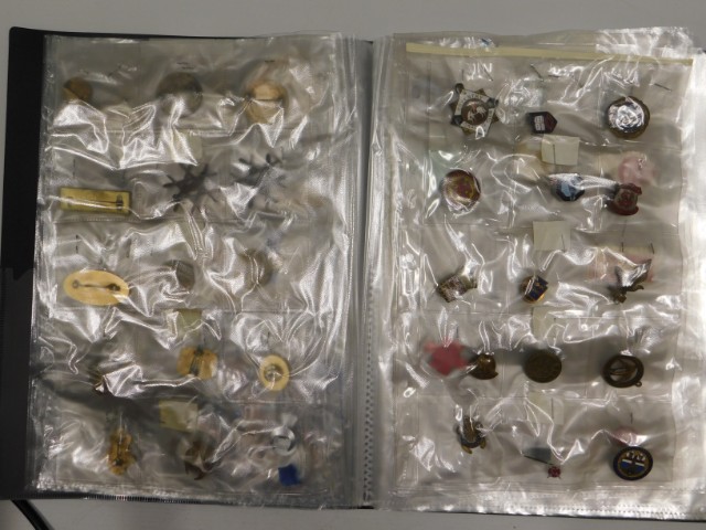 An album of lapel & pin badges, approx. 81