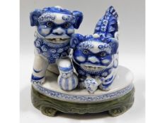 A 20thC. Chinese porcelain figure group of foo lio