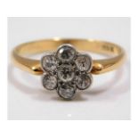 An 18ct gold daisy ring set with approx. 0.5ct dia
