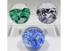 Three Liskeard glass paperweights, two dated 1977