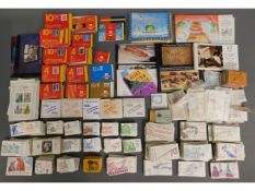 A large quantity of stamp books & mint stamps, approx. face value £1181.13 of pence stamps