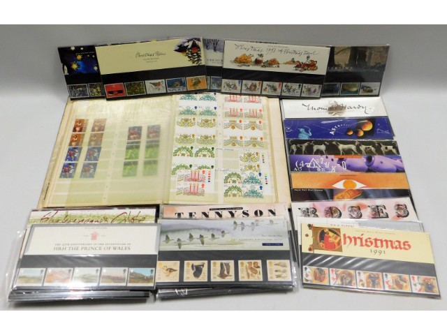 Fifty two presentation packs & a mint stamp album