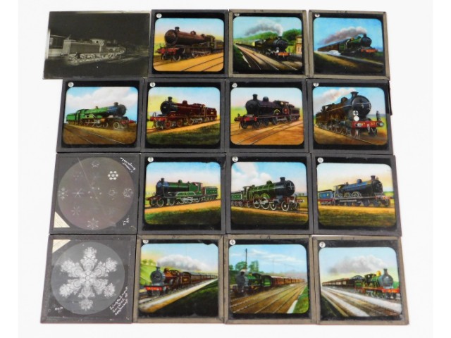 Thirteen coloured glass slides featuring steam loc