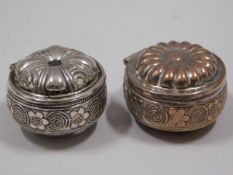 A white metal Omani patch box with one silver plat