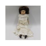 A porcelain headed doll, 14in tall