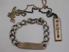 A silver ingot & chain twinned with a silver ident