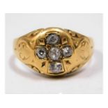 A Victorian yellow metal ring with carved decor, t
