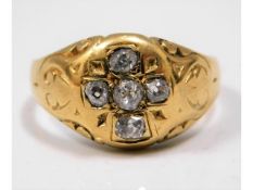 A Victorian yellow metal ring with carved decor, t