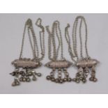 Three Omani white metal amulets, 127.4g
