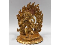 An ormolu style gilded figure of Tibetan God of Ra