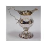 A George III, 1774 London silver jug, rubbed maker
