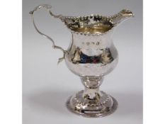 A George III, 1774 London silver jug, rubbed maker