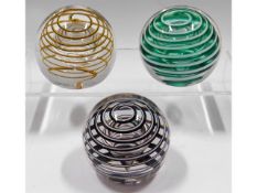 Three Liskeard glass paperweights, two dated 1977