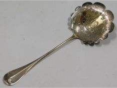 An ornate continental silver dessert serving spoon