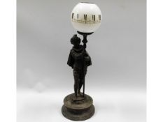 A 19thC. figurative spelter mechanical clock lamp