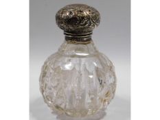 A silver topped scent bottle, 4.25in tall