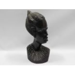 An African carved hardwood bust, 12in tall