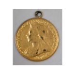 A mounted 1901 late Victorian half gold sovereign,