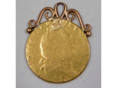 A mounted George III gold guinea, 8g