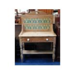 A Victorian stripped pine washstand with tiled bac