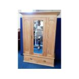 A Victorian three piece pitch pine wardrobe, 54.5i